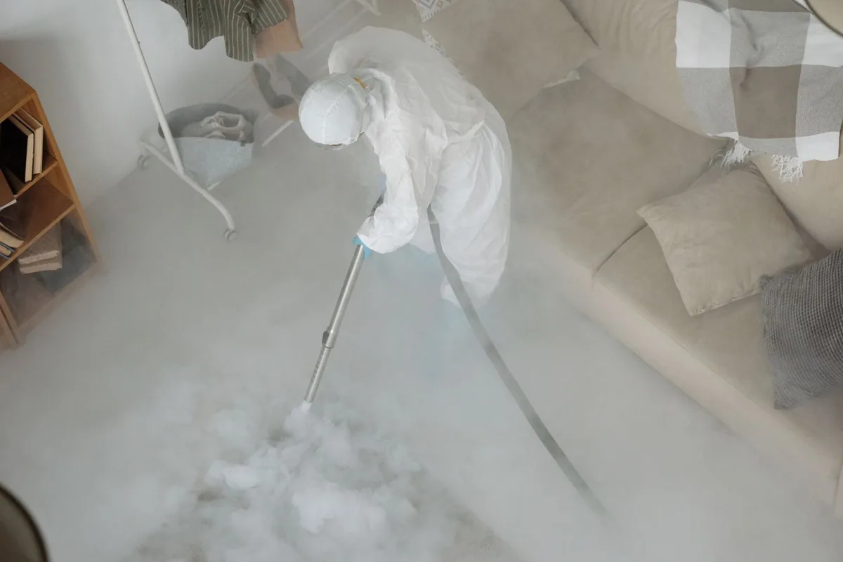 Biohazard cleanup technician in protective equipment, Nahant, MA